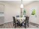 Cozy breakfast nook with natural light, table seating for four, and access to the outdoors at 1003 Dorsey Dr, Fort Mill, SC 29715