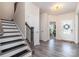 Welcoming foyer with staircase, stylish lighting, and decorative details throughout at 1003 Dorsey Dr, Fort Mill, SC 29715