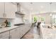 Well-lit kitchen with modern appliances, granite countertops, and stylish white backsplash at 1003 Dorsey Dr, Fort Mill, SC 29715
