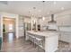 Spacious kitchen with large island, stainless steel appliances, and modern pendant lighting at 1003 Dorsey Dr, Fort Mill, SC 29715