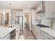 Modern kitchen with stainless steel appliances, granite countertops, and sleek gray cabinetry at 1003 Dorsey Dr, Fort Mill, SC 29715