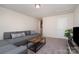 Spacious living room with a large sectional and wood coffee table on carpet at 1003 Dorsey Dr, Fort Mill, SC 29715