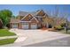 Beautiful two-story brick home with a three-car garage and a spacious driveway at 10104 Silverling Dr, Waxhaw, NC 28173