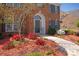 Inviting front entrance with beautiful landscaping and a charming walkway at 10104 Silverling Dr, Waxhaw, NC 28173