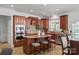 Kitchen with wood cabinets, granite countertops, stainless appliances, and a kitchen island at 10104 Silverling Dr, Waxhaw, NC 28173
