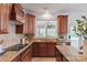 Updated kitchen featuring granite countertops, wood cabinets, stainless steel appliances and an eat-in breakfast area at 10104 Silverling Dr, Waxhaw, NC 28173