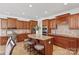 Beautiful kitchen with wood cabinets, granite countertops, and a center island with bar stool seating at 10104 Silverling Dr, Waxhaw, NC 28173