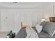 Spacious main bedroom featuring a tray ceiling and access to the ensuite bathroom through double doors at 10104 Silverling Dr, Waxhaw, NC 28173