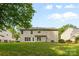 Backyard of the home with a lush green lawn surrounded by neighboring trees at 1014 Sandbox Cir, Indian Trail, NC 28079
