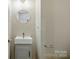Charming bathroom features a modern sink and vanity with a round mirror at 1014 Sandbox Cir, Indian Trail, NC 28079
