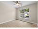 Comfortable bedroom with a ceiling fan and view from the window at 1014 Sandbox Cir, Indian Trail, NC 28079