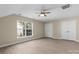 Neutral bedroom featuring a ceiling fan, closet, and light wood-look floors at 1014 Sandbox Cir, Indian Trail, NC 28079
