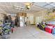 Spacious garage with ample storage, shelving, and a stainless steel refrigerator at 1014 Sandbox Cir, Indian Trail, NC 28079