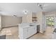 Well lit kitchen with stainless steel dishwasher and sink overlooking the living space at 1014 Sandbox Cir, Indian Trail, NC 28079