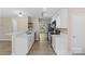 Modern kitchen with stainless steel appliances, white cabinets and lots of counter space at 1014 Sandbox Cir, Indian Trail, NC 28079