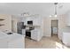 Bright kitchen with stainless steel appliances and white cabinetry. Includes laundry area at 1014 Sandbox Cir, Indian Trail, NC 28079