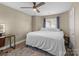 Cozy bedroom with hardwood floors, ceiling fan, and a built-in vanity at 1109 E Morehead St # 22, Charlotte, NC 28204