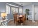 Cozy dining area with bay window, chandelier, and seating for four at 1109 E Morehead St # 22, Charlotte, NC 28204