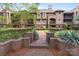 Beautiful multi-story condo building with brick pathway, manicured landscaping, and balcony views at 1109 E Morehead St # 22, Charlotte, NC 28204