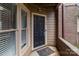 Close-up of a front door with storm door and sidelight window at 1109 E Morehead St # 22, Charlotte, NC 28204