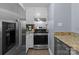 Kitchen featuring stainless steel appliances, granite countertops, and white cabinetry at 1109 E Morehead St # 22, Charlotte, NC 28204
