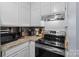 Kitchen featuring stainless steel appliances, granite countertops, and white cabinetry at 1109 E Morehead St # 22, Charlotte, NC 28204