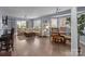 Living room features include a corner sofa, hardwood floors, and sunlit windows at 1109 E Morehead St # 22, Charlotte, NC 28204