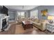 Bright living room with a fireplace, hardwood floors, large sofa and lots of natural light at 1109 E Morehead St # 22, Charlotte, NC 28204