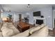 Spacious living room featuring a fireplace, hardwood floors, and plenty of natural light at 1109 E Morehead St # 22, Charlotte, NC 28204