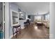 Spacious living room with hardwood floors, fireplace, bar seating, and neutral tones at 1109 E Morehead St # 22, Charlotte, NC 28204
