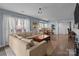 Open concept living room with hardwood floors, large windows, and comfortable seating at 1109 E Morehead St # 22, Charlotte, NC 28204