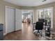 Inviting home office with hardwood floors, natural light, and direct access to the living and dining areas at 1109 E Morehead St # 22, Charlotte, NC 28204