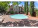 Community pool area with a large pool, seating, and well-maintained landscaping at 1109 E Morehead St # 22, Charlotte, NC 28204