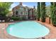 A stunning community pool area surrounded by mature trees and beautifully kept grounds at 1109 E Morehead St # 22, Charlotte, NC 28204