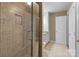 Shower featuring tile, glass door, stainless fixtures, and in-bathroom access at 1109 E Morehead St # 22, Charlotte, NC 28204