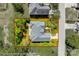 An aerial lot line view of a single-Gathering home highlighting the backyard deck and surrounding trees at 1126 Blowing Rock Cv, Fort Mill, SC 29708