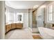 Bright bathroom features a soaking tub, frameless shower, and double vanity sinks at 1126 Blowing Rock Cv, Fort Mill, SC 29708