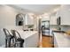 Modern kitchen with white cabinets, quartz countertops, stainless steel appliances, and hardwood floors at 1126 Blowing Rock Cv, Fort Mill, SC 29708