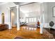 Spacious living room with hardwood floors, high ceilings, large windows, and modern furniture at 1126 Blowing Rock Cv, Fort Mill, SC 29708