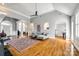 Open-concept space with multiple seating areas and hardwood flooring at 1126 Blowing Rock Cv, Fort Mill, SC 29708