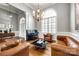 Sitting area with chandelier, hardwood flooring, and leather chairs and sofa at 1126 Blowing Rock Cv, Fort Mill, SC 29708