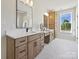 Spa-like bathroom with dual vanities, lots of cabinet space, and a large window offering natural light at 1160 Springlake Rd, York, SC 29745