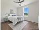Cozy bedroom featuring a comfortable bed with bedside table, a rug, and a window with beautiful outdoor views at 1160 Springlake Rd, York, SC 29745