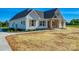 Charming exterior with a well-manicured lawn and inviting walkway leading to the front entrance at 1160 Springlake Rd, York, SC 29745