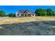 A full front view of the home, showing its architectural details and spacious lawn at 1160 Springlake Rd, York, SC 29745