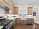Stylish kitchen with stainless steel appliances, apron sink and custom cabinets at 1160 Springlake Rd, York, SC 29745