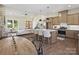 Open kitchen features a large island with counter seating and modern appliances with seamless flow to the living area at 1160 Springlake Rd, York, SC 29745