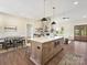 Open concept kitchen with island, modern pendant lights, and stainless appliances at 1160 Springlake Rd, York, SC 29745