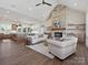 Open living space with stone fireplace, wood floors, and vaulted ceiling at 1160 Springlake Rd, York, SC 29745