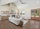 Open-concept living room with a soaring stone fireplace, vaulted ceilings and direct access to the outdoors at 1160 Springlake Rd, York, SC 29745